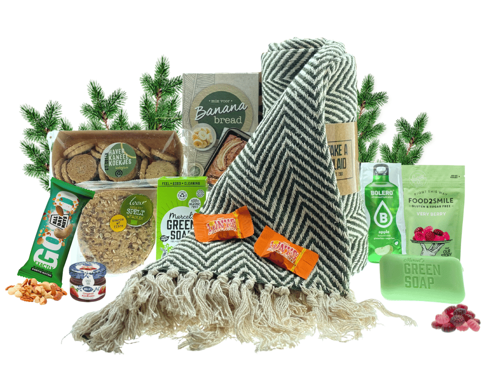 Kerstpakket Go Green met allemaal groene artikelen zoals etenswaren, een dekentje en groene zeep