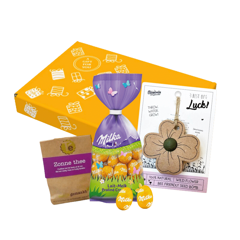 Paasgeschenk met zaden voor klavertjes vier, zonne thee en heerlijke Milka paaseieren.